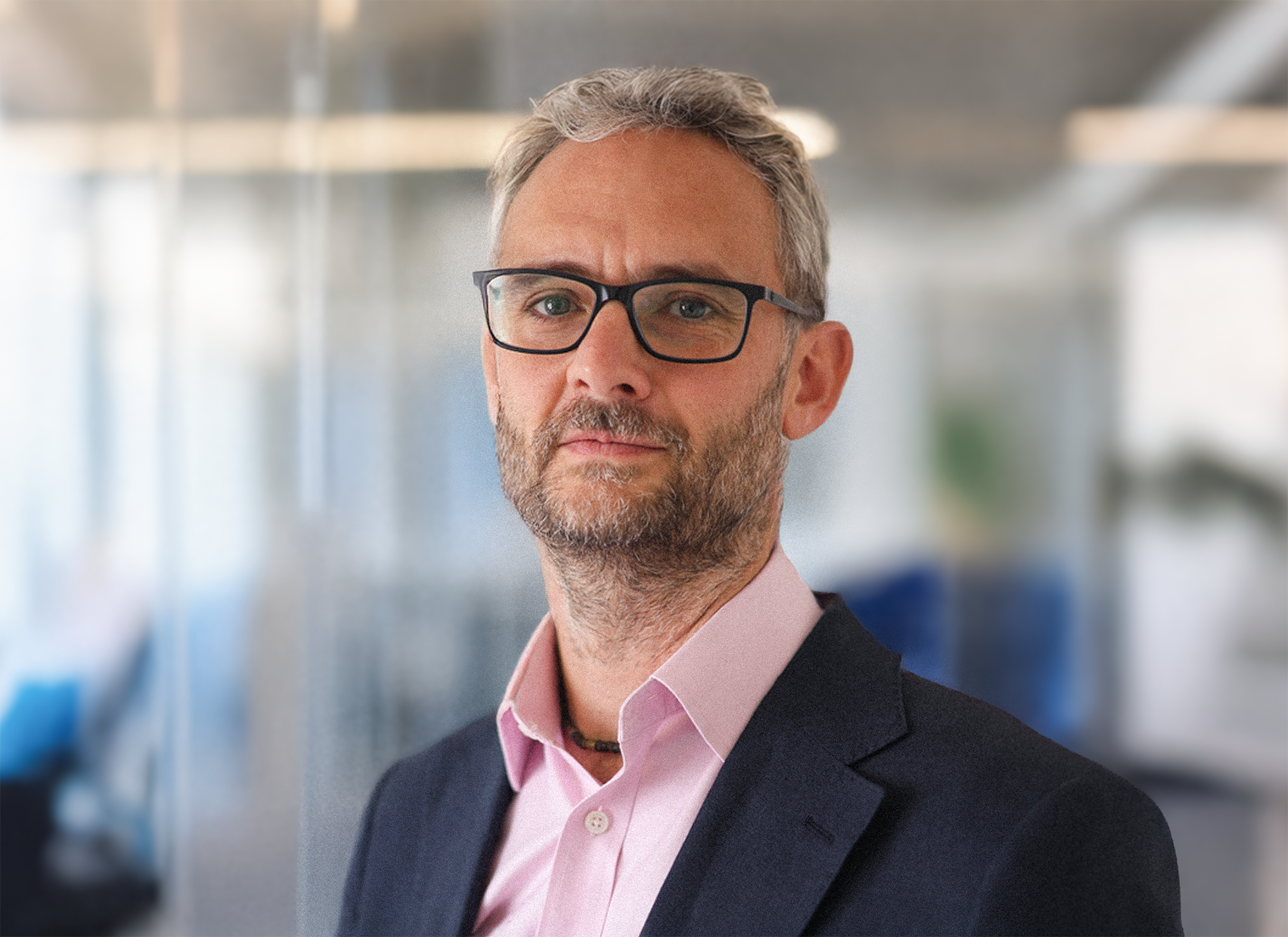 Professional portrait of Chris Morrow, founder of MU Consulting, specialising in clean energy and engineering strategy.